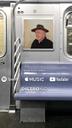 Bill Pasco in a cowboy hat riding on a train, Lonely People